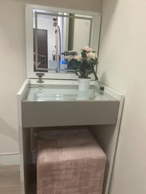 a bathroom sink with a mirror and a plant on it at Luxury Ocean View Barranco Apt, 17th Floor AC in Lima