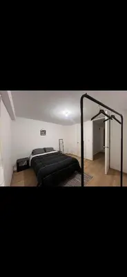 a bedroom with a bed in a room at Habitación con baño privado, duplex con ambientes compartidos in Lima