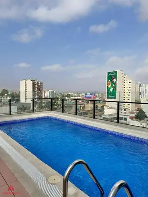 a swimming pool on the roof of a building at Fantastic 1BR at Barranco in Lima