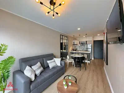 a living room with a couch and a table at Fantastic 1BR at Barranco in Lima