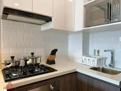a kitchen with a stove top oven next to a sink at Fantastic 1BR at Barranco in Lima