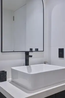 a white tub in a bathroom with a mirror at Geko | Contemporary 2BR w/Balcony near Costa Verde in Lima