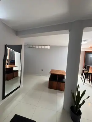 a living room with a table and a dining room at 3 bedroom apartment Ayacucho - Perú in Ayacucho