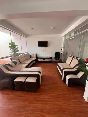 a living room with two couches and a flat screen tv at Casa de playa con Piscina I-101 in Punta Negra