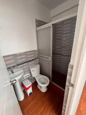 a bathroom with a toilet and a sink at Casa de playa con Piscina I-101 in Punta Negra