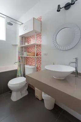 a bathroom with a sink and a toilet and a mirror at Sarapampa punto Asia in Asia