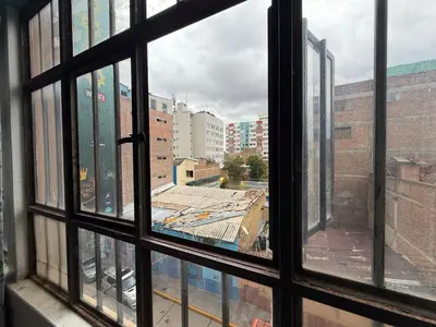 a view from an open window of a building at Hospedaje Tarapacá in Huancayo