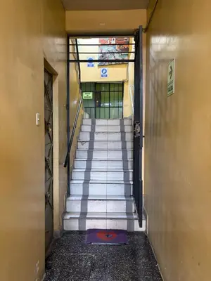 a stairway in a building with a bunch of stairs at Hospedaje Tarapacá in Huancayo
