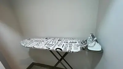 a table with a pillow and a phone on it at Barranco apartment facing the ocean in Lima