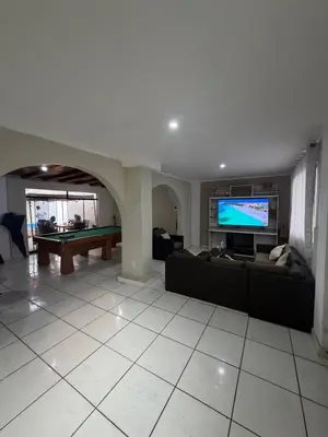 a living room with a couch and a pool table at Casa de playa in Arica