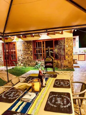 a table in a tent with a stove and a table sidx sidx at Casa de Campo Quives Majestuoso 5BR in Santa Rosa de Quives