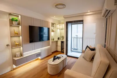a living room with a couch and a flat screen tv at Miraflores Prime Apartment - full AC-Kennedy Park in Lima