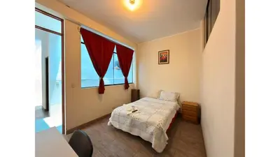 a small bedroom with a bed and a window at CHANCAY 1er Piso Como en Casa in Chancay