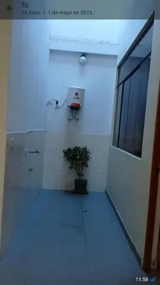a bathroom with a potted plant in a room at CHANCAY 1er Piso Como en Casa in Chancay