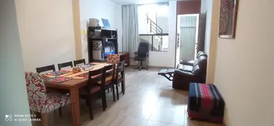 a living room with a dining room table and chairs at CHANCAY 1er Piso Como en Casa in Chancay