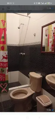 a bathroom with a toilet and a sink at CHANCAY 1er Piso Como en Casa in Chancay