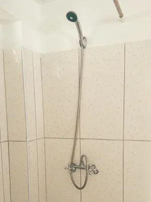a shower with a shower head in a bathroom at Departamento en Ayacucho in Ayacucho