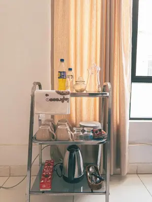 a tea cart with dishes and utensils on it at Departamento en Ayacucho in Ayacucho
