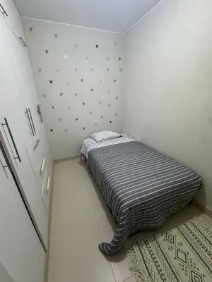 a small bedroom with a bed in the corner at Apartment in San Bartolo - Playa Norte in San Bartolo