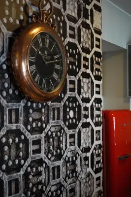 a clock is hanging on a wall at Larcomar Luxury Penthouse in Lima