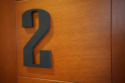 a letter b on a wooden door at Larcomar Luxury Penthouse in Lima