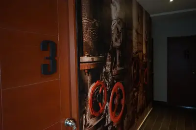 a wall with bikes painted on it in a hallway at Larcomar Luxury Penthouse in Lima