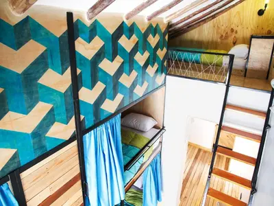 a bunk bed room with a bunk bed in a room at Supertramp Hostel Cusco in Cusco