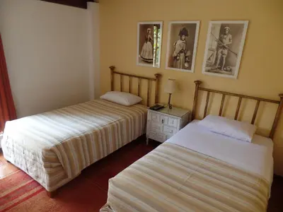 two beds in a room with two beds sidx sidx sidx at El Patio Miraflores in Lima