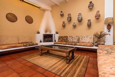 a living room with couches and a fireplace at El Patio Miraflores in Lima