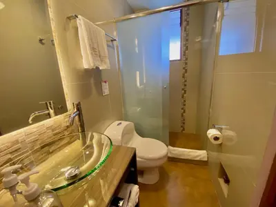 a bathroom with a sink and a toilet and a shower at Mistico San Blas Boutique in Cusco