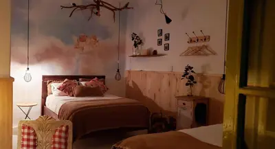a bedroom with a bed in a room at Niños Hotel Meloc in Cusco