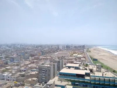 an aerial view of a city and the beach at Ocean View Beautiful Aparment in Lima