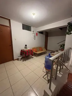 a living room with a couch and a table at Hospedaje el Telar in Nazca