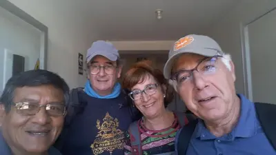 three men and a woman posing for a picture at Hospedaje el Telar in Nazca