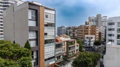 an aerial view of a city with tall buildings at Hotel Ferré Miraflores in Lima