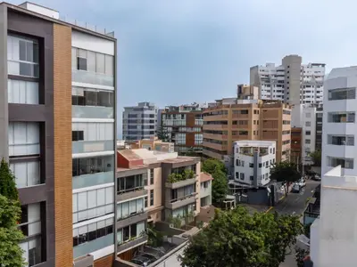 an aerial view of a city with tall buildings at Hotel Ferré Miraflores in Lima