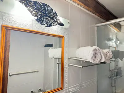 a bathroom with a mirror and a shower at ARQUEOLOGO Exclusive Boutique Hotel Cusco - Centro Histórico in Cusco