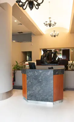 a lobby with a marble counter top in a room at J&A Classic Hotel in Lima
