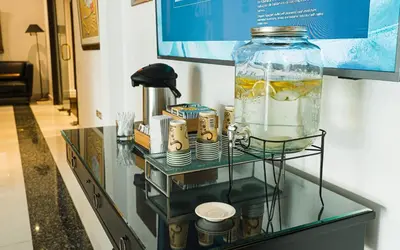 a glass shelf with a large jar on top of it at LUOXO Hotel in Lima