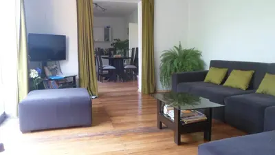 a living room with a couch and a table at House in Cusco in Cusco