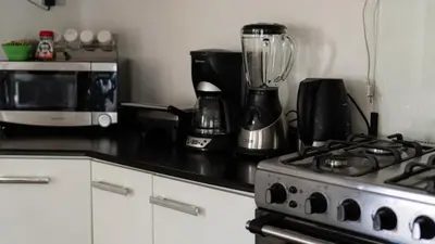 a kitchen with a stove and a blender on a counter at House in Cusco in Cusco