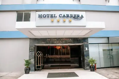 a hotel entrance with a hotel carnegie sign on it at Hotel Carrera in Lima