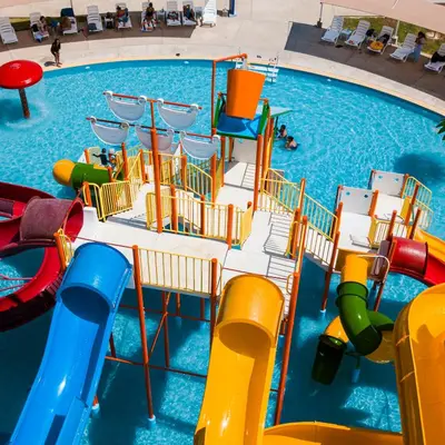 an indoor swimming pool with a water park at Hacienda San Juan Resort in Ica