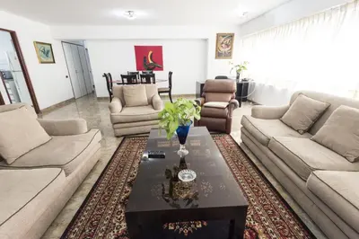 a living room with couches and a coffee table at Apartamento Edificio Pardo Cinco in Lima