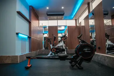 a gym with two exercise bikes in a room at Lyz Business Hotel in Lima