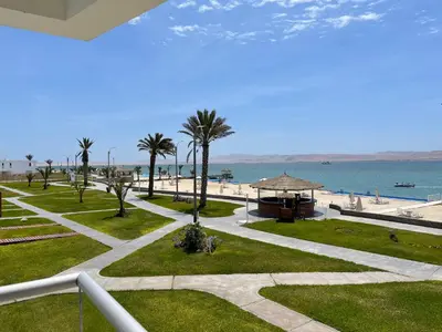 a view of the beach from the balcony of a resort at ooo OCEAN VIEW APARTMENT PARACAS SOTAVENTO ooo in Paracas