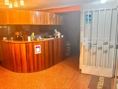 a kitchen with a counter and aacistacistacistacistacist at Hostal El Rancho in Huancayo