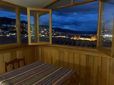 a room with a window with a table and a view at Hospedaje Killipata in Cusco