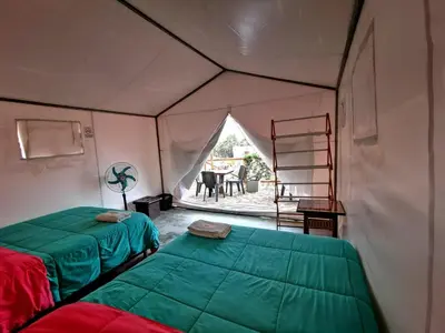 a room with two beds in a tent at Ecocamp Huacachina in Ica