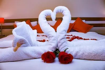 two swans made out of towels on a bed at Cusco House in Cusco